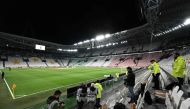 Photographers take pictures of the empty Juventus stadium before the Italian Serie A football match Juventus vs Inter Milan which will be played behind closed doors, in Turin on March 8, 2020. AFP / Vincenzo Pinto 