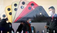 People wearing protective masks are seen in an Apple Store as China is hit by an outbreak of the new coronavirus, in Shanghai, China, January 29, 2020. Reuters / Aly Song