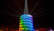 In this file photo taken on April 15, 2018 people enter and exit the Spectra installation by Newsubstance Sunday at the Coachella Music and Arts Festival in Indio, California. Coachella postponed until October over COVID-19 (coronavirus), organizers annou