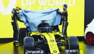 Renault's Australian driver Daniel Ricciardo (R) and Renault's French driver Esteban Ocon (L) unveil the team's new car at the Albert Park circuit ahead of the Formula One Australian Grand Prix in Melbourne on March 11, 2020. AFP / William West