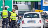 Policemen control a car at the border crossing Brenner in Austria, on March 11, 2020. AFP /  Johann GRODER