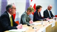 (From L) Swiss Economy Minister Guy Parmelin, Swiss Justice Minister Karin Keller-Sutter, Swiss President Simonetta Sommaruga and Swiss Interior Minister Alain Berset attend a press conference on the new preventive measures against the spread of the COVID