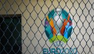 The Euro 2020 logo behind a fence at the headquarters of UEFA, the European football's governing body, amid spread of novel coronavirus (COVID-19).  AFP / FABRICE COFFRINI