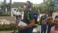 South Africa's cricket player Faf du Plessis wearing a facemask amid concerns over the spread of the COVID-19 novel coronavirus, arrives at a hotel in Kolkata on March 16, 2020. / AFP / Dibyangshu SARKAR