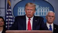 U.S. President Donald Trump addresses the daily coronavirus response briefing as Seema Verma, administrator of the Centers for Medicare & Medicaid Services, and Vice President Mike Pence look on at the White House in Washington, U.S., March 18, 2020. REUT