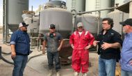 Dale Redman, CEO of ProPetro, speaks with workers on a yard where he stores and manages equipment for his Midland fracking services company in Midland, Texas, on April 12, 2018. Reuters/Ann Saphir
 
  
