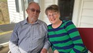 Grace Dowell, 63, and her husband Donald Dowell, 74, pose for a photo at their home in Sunderland, Maryland, U.S., March 18, 2020. Picture taken March 18, 2020. REUTERS/Linda So
