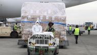 Ethiopian Airlines workers transport a consignment of medical donation from Chinese billionaire Jack Ma and Alibaba Foundation to Africa for coronavirus disease (COVID-19) testing, upon arrival at the Bole International Airport in Addis Ababa, Ethiopia Ma