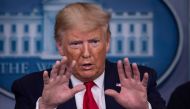 US President Donald Trump gestures as he speaks during the daily briefing on the novel coronavirus, COVID-19, at the White House on March 22, 2020, in Washington, DC. AFP / Eric Baradat
 
