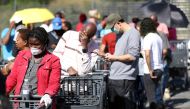 Shoppers queue to stock up on groceries at a Pick n Pay store during a nationwide lockdown of 21 days to try to contain the coronavirus disease (COVID-19) outbreak, in Johannesburg, South Africa, March 24, 2020. REUTERS/Siphiwe Sibeko