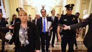 Treasury Secretary Steven Mnuchin (C) leaves the offices of Minority Leader Charles Schumer (D-NY) as negotiations continue into the night on a $2 trillion economic stimulus in response to the coronavirus pandemic at the U.S. Capitol March 24, 2020 in Was