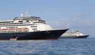 Passengers board a lifeboat from Holland America Line cruise ship MS Zaandam to be transported to her sister ship Rotterdam (R) on Panama Bay, Panama during a coronavirus disease (COVID-19) outbreak on March 28, 2020. Panama Maritime Authority/Handout va 
