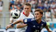 FILE PHOTO: Soccer Football - World Cup - Group H - Japan vs Poland - Volgograd Arena, Volgograd, Russia - June 28, 2018 Japan's Gotoku Sakai in action with Poland's Piotr Zielinski REUTERS/Jorge Silva/File Photo