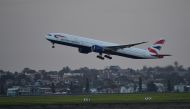 A British Airways flight takes off from Sydney International Airport in Sydney on March 27, 2020. AFP / Saeed Khan 