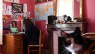A high school student takes a test online at her home in Chisseaux near Tours on March 27, 2020, on the eleventh day of a lockdown in France to stop the spread of the novel coronavirus COVID-19. / AFP / Alain Jocard 