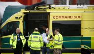 Paramedics and military personnel are seen outside the Excel Centre, London while it is being prepared to become the NHS Nightingale Hospital, as the spread of the coronavirus disease (COVID-19) continues, London, Britain, April 1, 2020. REUTERS/Henry Nic
