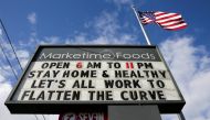 A neighborhood market marquee reads 