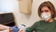 This image courtesy of Diana Berrent shows her getting her blood drawn at pathology laboratory at Columbia University Irving Medical Center on March 30, 2020 in New York. AFP PHOTO / Diana Berrent