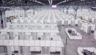A member of the U.S. Army walks among cubicles being prepared in phase 2 of the Javits new york medical Station at the Jacob K. Javits Convention Center during the coronavirus disease (COVID-19) outbreak in Manhattan, New York City, U.S., April 3, 2020. R
