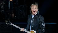 (FILES) In this file photo taken on July 26, 2017 Sir Paul McCartney performs in concert during his One on One tour at Hollywood Casino Amphitheatre in Tinley Park, Illinois. A sheet of paper bearing Paul McCartney's handwritten lyrics to 