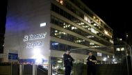 FILE PHOTO: Police officers outside of the St Thomas' Hospital after British Prime Minister Boris Johnson was moved to intensive care after his coronavirus (COVID-19) symptoms worsened and has asked Foreign Secretary Dominic Raab to deputise. London, Brit