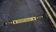 Social distance markings are seen on a street in London, as the spread of the coronavirus disease (COVID-19) continues, London, Britain, April 13, 2020. REUTERS/Hannah McKay