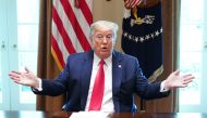 US President Donald Trump speaks during a meeting with patients who have recovered from the novel coronavirus, COVID-19, in the Cabinet Room of the White House in Washington, DC on April 14, 2020.  / AFP / MANDEL NGAN
