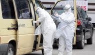 Medical workers in protective suits are pictured at University Clinical Center of Kosovo in Pristina, Kosovo, April 15, 2020. REUTERS/Laura Hasani