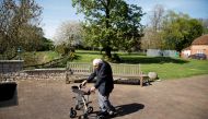 Retired British Army Captain Tom Moore, 99, raises money for health workers by attempting to walk the length of his garden one hundred times before his 100th birthday this month as the spread of coronavirus disease (COVID-19) continues, Marston Moretaine,