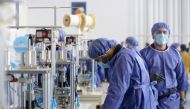 Tehran, IRAN - APRIL 14: A worker, wearing a face mask, produces masks to be used as a preventive measure against the coronavirus (COVID-19) pandemic at a factory, aiming to produce four million masks a day, at Eshtehard Industrial Town in Eshtehard, some