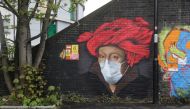 Street art depicting a painting by Jan van Eyck with a face mask is seen in Ladywell, as the spread of the coronavirus disease (COVID-19) continues, London, Britain, April 18, 2020. REUTERS/Simon Dawson