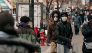 Pedestrians wear face masks on Fulton Street on April 17, 2020 in the Brooklyn borough of New York City. (Scott Heins/Getty Images/AFP)