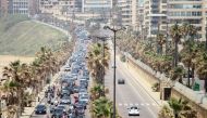 Dozens of Lebanese protesters defy a stay-at-home order to protest in their cars deteriorating living conditions and maintain pressure on a political elite under fire since mass protests erupted last October, in the capital Beirut on April 21, 2020. AFP /
