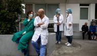 Medical workers watch a concert of the Hellenic Broadcasting Corporation (ERT) orchestra at the premises of Evangelismos hospital, following the coronavirus disease (COVID-19) outbreak in Athens, Greece, April 20, 2020. REUTERS/Alkis Konstantinidis 