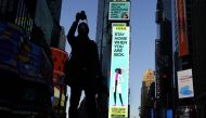 :Some of the nearly 1,800 digital billboards and screens across all five boroughs are displaying messages of public safety, gratitude, pride, and solidarity with essential workers as seen in Times Square April 19, 2020 in New York. / AFP / TIMOTHY A. CLAR