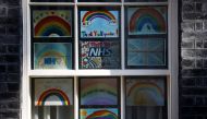 Tributes to the NHS are seen in a window of 10 Downing Street, Britain's Prime Minister Boris Johnson is to return to work on Monday after recovering from the coronavirus disease (COVID-19), London, Britain, April 26, 2020. REUTERS/Henry Nicholls