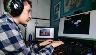 Fourth grade pupil 9-year-old boy Lupo Daturi displays 