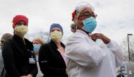 Healthcare workers react as police officers and firefighters thank them at Beth Israel Deaconess Hospital Milton amid the coronavirus disease (COVID-19) outbreak in Milton, Massachusetts, U.S., April 28, 2020. REUTERS/Brian Snyder 