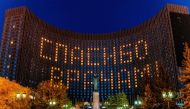 This picture taken on April 29, 2020, shows a view of huge lettering reading “Thanks to Doctors” formed by turned on lights in rooms of Kosmos hotel in Moscow, during a strict lockdown in Russia to stop the spread of the COVID-19 infection caused by the n