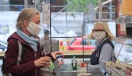 A customer at the food discounter ALDI is wearing a protective mask, as the spread of coronavirus disease (COVID-19) continues in Duesseldorf, Germany, April 29, 2020. REUTERS/Wolfgang Rattay