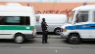 A police officer stands in front of the Al-Irschad Mosque during a raid on April 30, 2020 in Berlin, as dozens of police and special forces stormed mosques and associations linked to Hezbollah in Bremen, Berlin, Dortmund and Muenster in the early hours of
