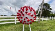 A sculpture in the likeness of a coronavirus particle is seen outside a property that borders a road leading to St. Michaels, Maryland, amid the coronavirus disease (COVID-19) outbreak in the U.S., April 27, 2020. REUTERS/Katharine Jackson 
