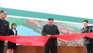 North Korean leader Kim Jong Un attends the completion of a fertiliser plant, together with his younger sister Kim Yo Jong, in a region north of the capital, Pyongyang, in this image released by North Korea's Korean Central News Agency (KCNA) on May 2, 20