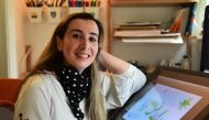 Artist Reem Ali Adeeb poses in her studio apartment in Los Angeles, California on April 29, 2020, where she is developing online tutorials in Arabic for children about art, including drawing and reading. AFP / Frederic J. Brown 