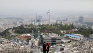 File photo: An Iranian couple is seen following the outbreak of the coronavirus disease (COVID-19), in Tehran, Iran, April 30, 2020. WANA (West Asia News Agency)/Ali Khara via REUTERS/File Photo