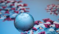 A globe showing Europe, Africa and Asia is pictured on an illustration representation of COVID-19, the disease caused by the novel coronavirus in Paris on April 24, 2020. AFP / JOEL SAGET