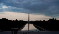 :The Washington Monument and the Lincoln Memorial Reflecting Pool are seen at sunset from inside the memorial as U.S. President Donald Trump participates in a Fox News Channel virtual town hall called 
