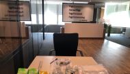 A thermometer, hand sanitizer and masks are pictured in the reception area at PageGroup's office after reopening, as the coronavirus disease (COVID-19) continues, in Shanghai, China, April 29, 2020. Picture taken April 29, 2020. PageGroup/Handout via REUT