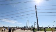 :DALLAS, TEXAS - MAY 06: People gather to watch the U.S. Navy Blue Angels flyover downtown Dallas to honor healthcare, frontline and essential workers on May 06, 2020 in Dallas, Texas. The Blue Angels performed a flyover as part of the 'America Strong' ca