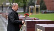 Russian President Vladimir Putin lays flowers at a memorial to the Hero Cities during a ceremony at the Tomb of the Unknown Soldier on Victory Day, which marks the anniversary of the victory over Nazi Germany in World War Two, amid the outbreak of the cor